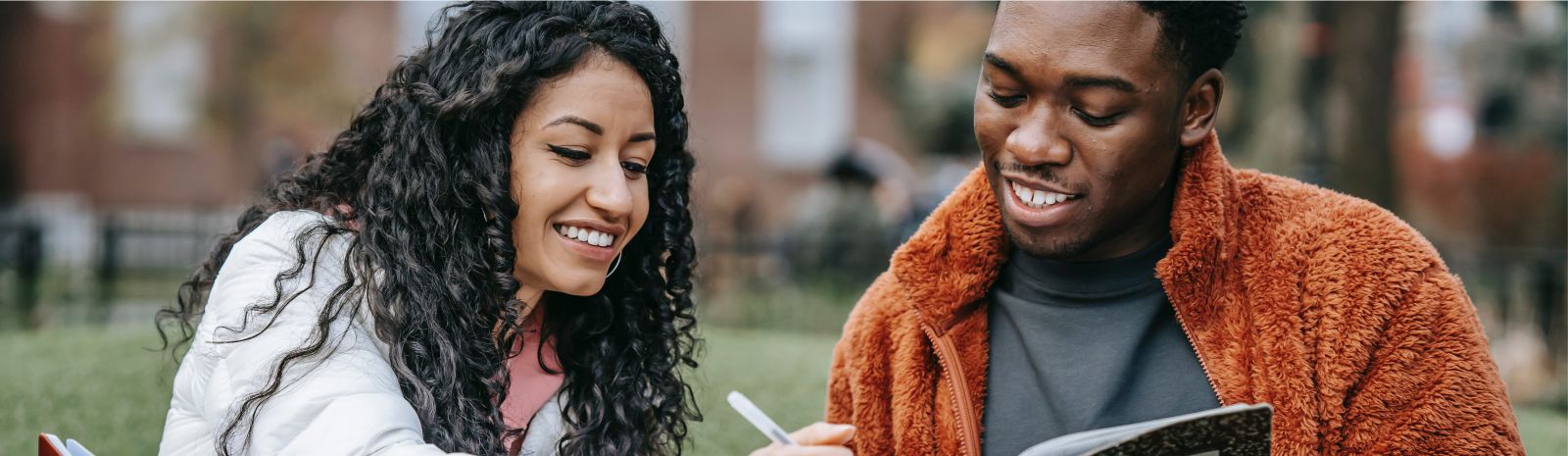 Two young people of color at a college campus