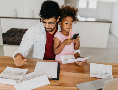 Father and daughter work through banking details